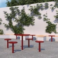 Sydhavn Outdoor Bar Table | 70 cm with matching red stools in a courtyard.