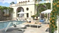 Holmen 2 Seater Public Lounge Bench by the pool in a sunny courtyard with modern decor