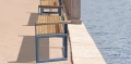 Outdoor modular Christiania 3 Seater Public Backrest Bench with Armrest by the waterfront.