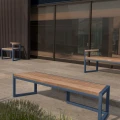 Christiania 4 Seater Public Backless Bench on a patio near modern building.