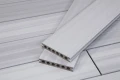 Two composite decking boards from the WPC SET SGLLSW (M2) + JOIST + PLASTIC CLIPS set placed on a decking surface.